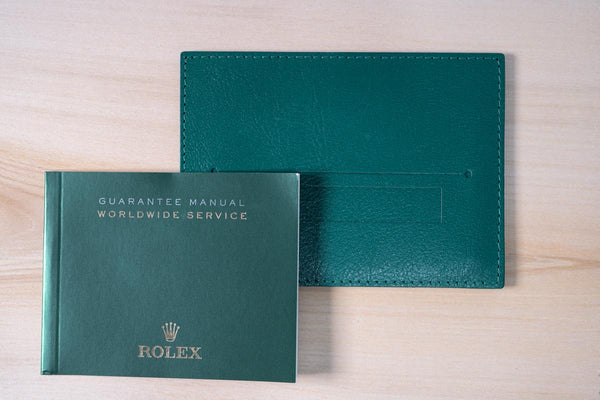 Original Rolex Guarantee manual with card sleeve.