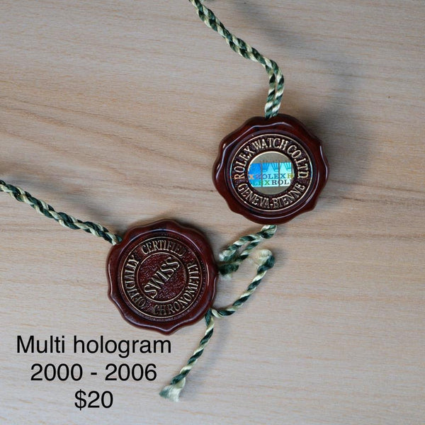Original Rolex Red hang tags with multi hologram.