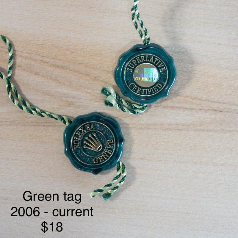 Original Rolex Green hang tags.