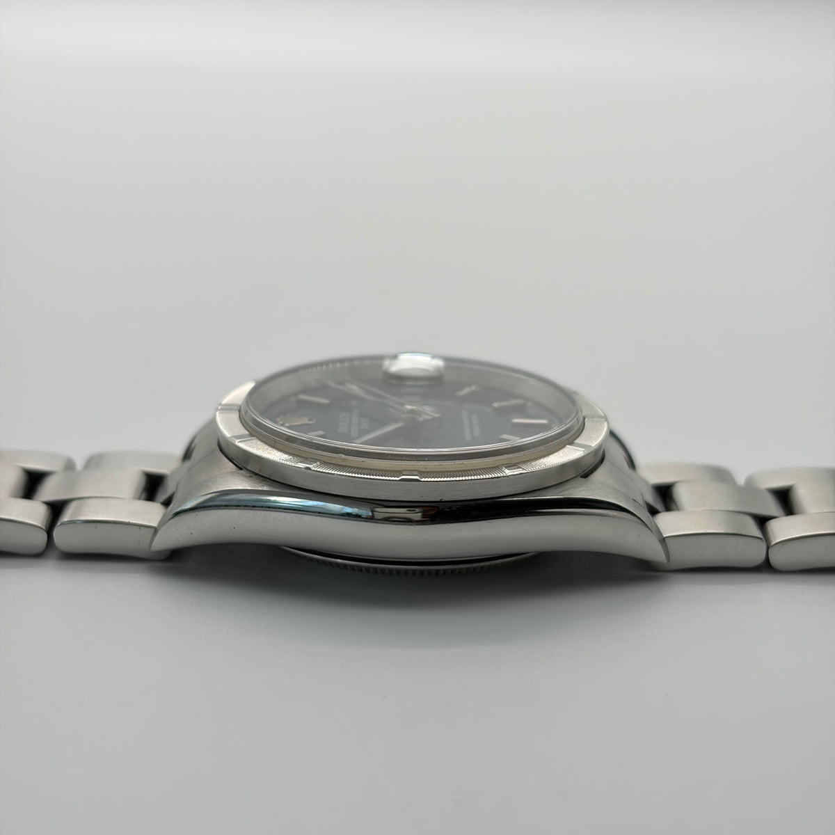 Rolex 15210 Oyster Perpetual Date "Blue Dial, Engine Turned Bezel"
